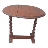 Coffee table with drop-leaf doors