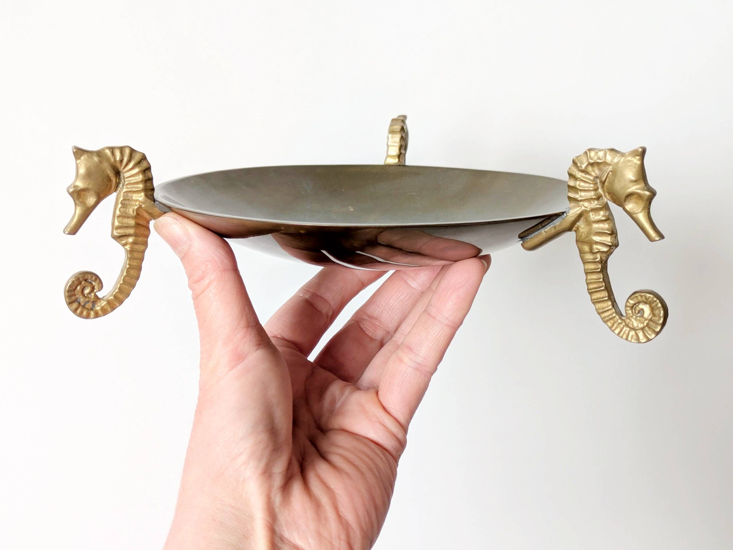 Vintage round brass tray on seahorse feet