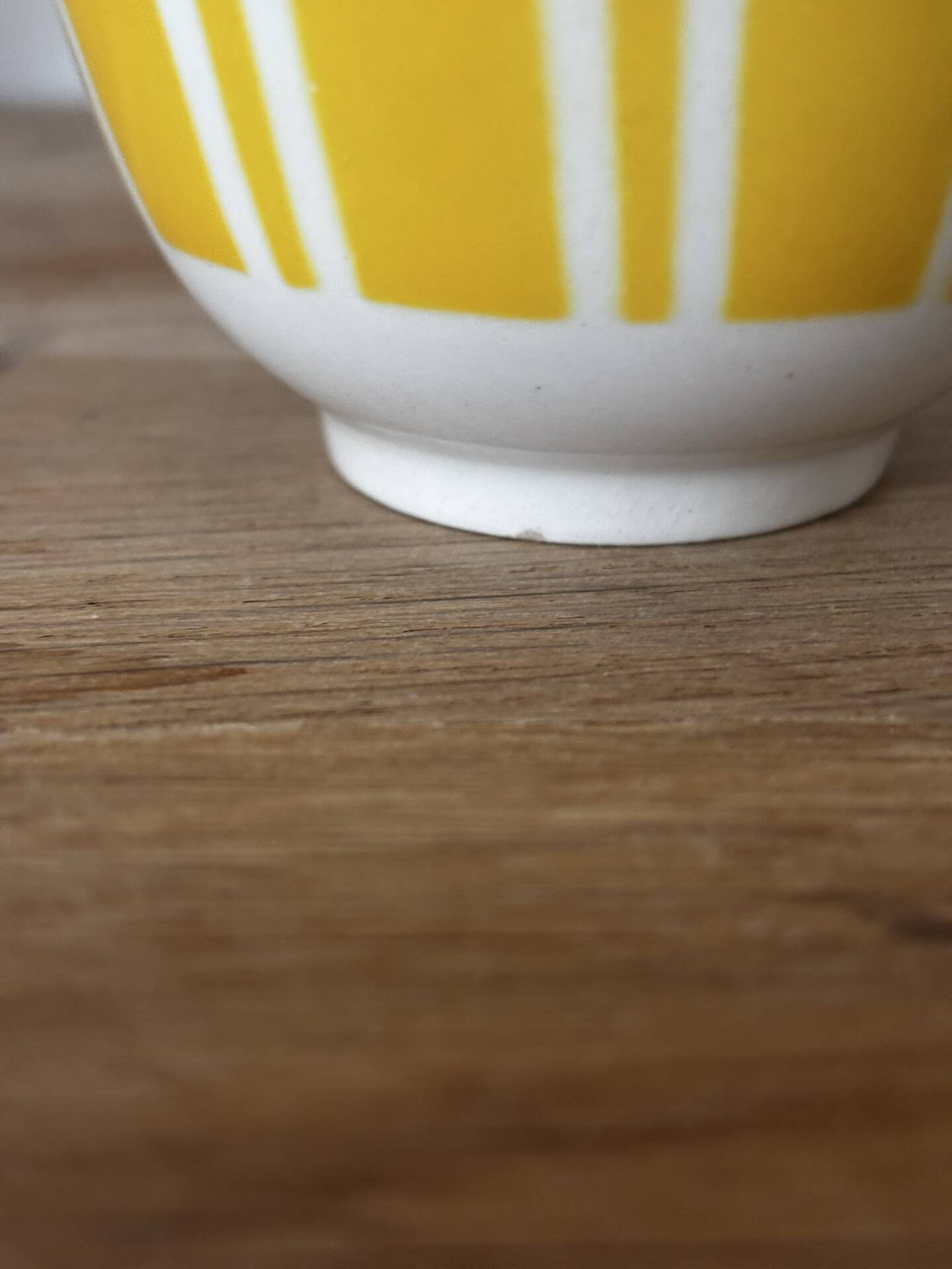 Set of two antique yellow Digoin Sarreguemines cups.