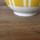 Set of two antique yellow Digoin Sarreguemines cups.
