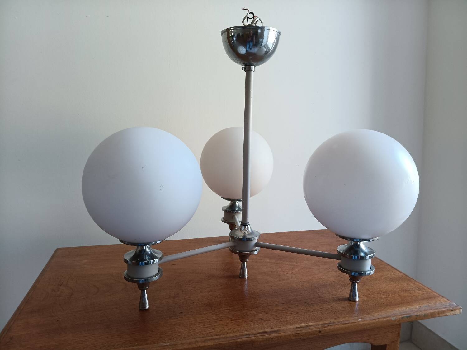 White ball and metal chandelier