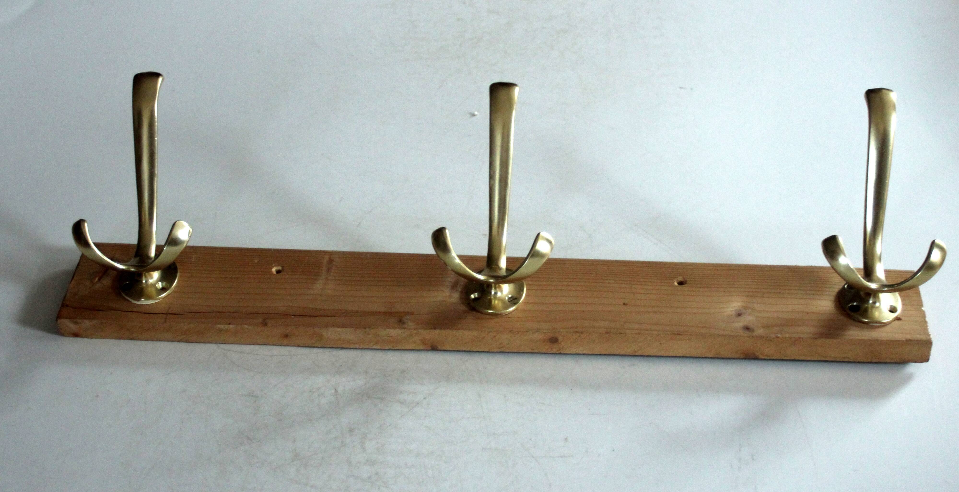 Wall mounted wooden coat rack with 3 brass hooks, vintage from the 50s