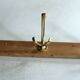 Wall mounted wooden coat rack with 3 brass hooks, vintage from the 50s