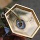 Vintage bedside lamp in gold metal – sculpted base and blue shade