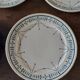 Série de huit assiettes plates terre de fer Géon Rouard décor Lille années