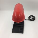 Duo of red and black flexible desk lamps with pencil holder
