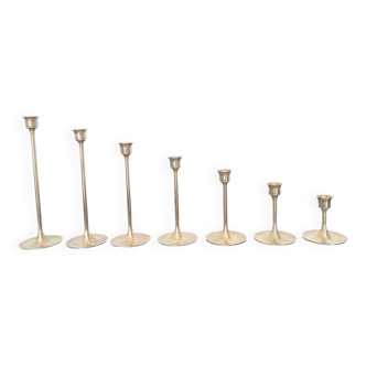 Graduated candle holders in golden brass