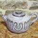 Enamelled ceramic tea set