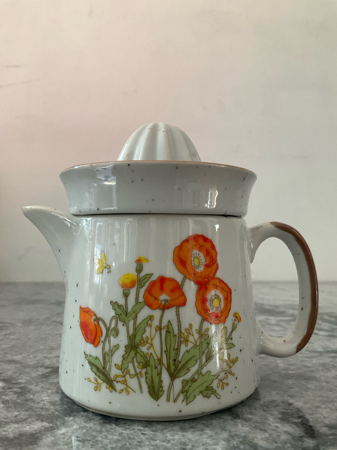 Vintage stoneware jug and its citrus juicer.
