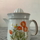 Vintage stoneware jug and its citrus juicer.