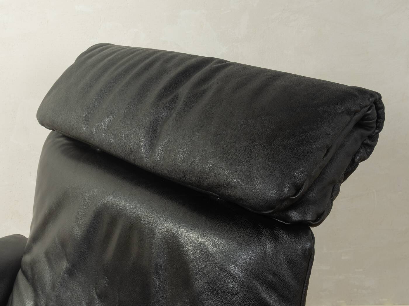 1980s cor armchair and ottoman in black leather