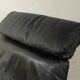 1980s cor armchair and ottoman in black leather