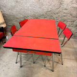 4 red Formica chairs with a 1970s table
