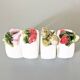 Lot de 4 ronds de serviette en barbotine.