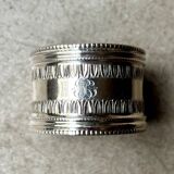 Monogrammed silver napkin ring with palmette and beaded motifs