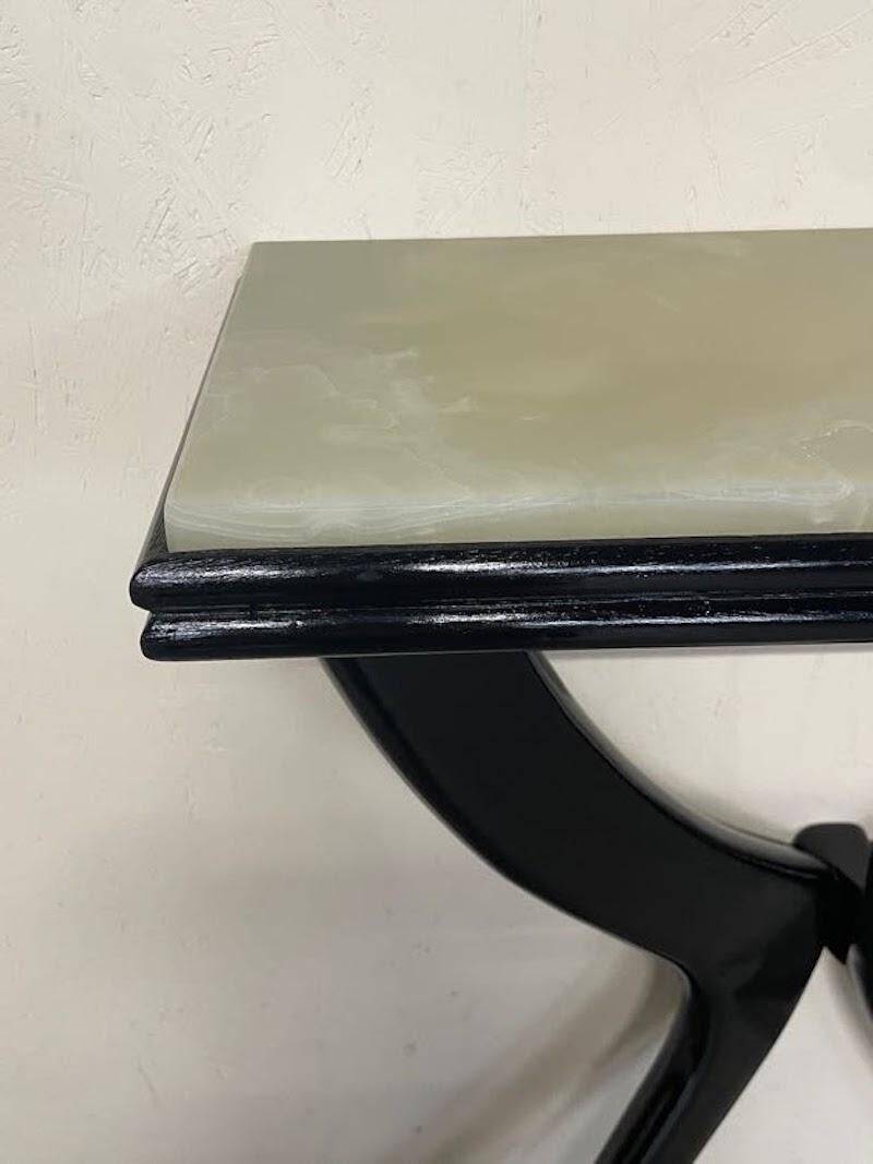 Console from the 1950s in ebonised wood and green marble.