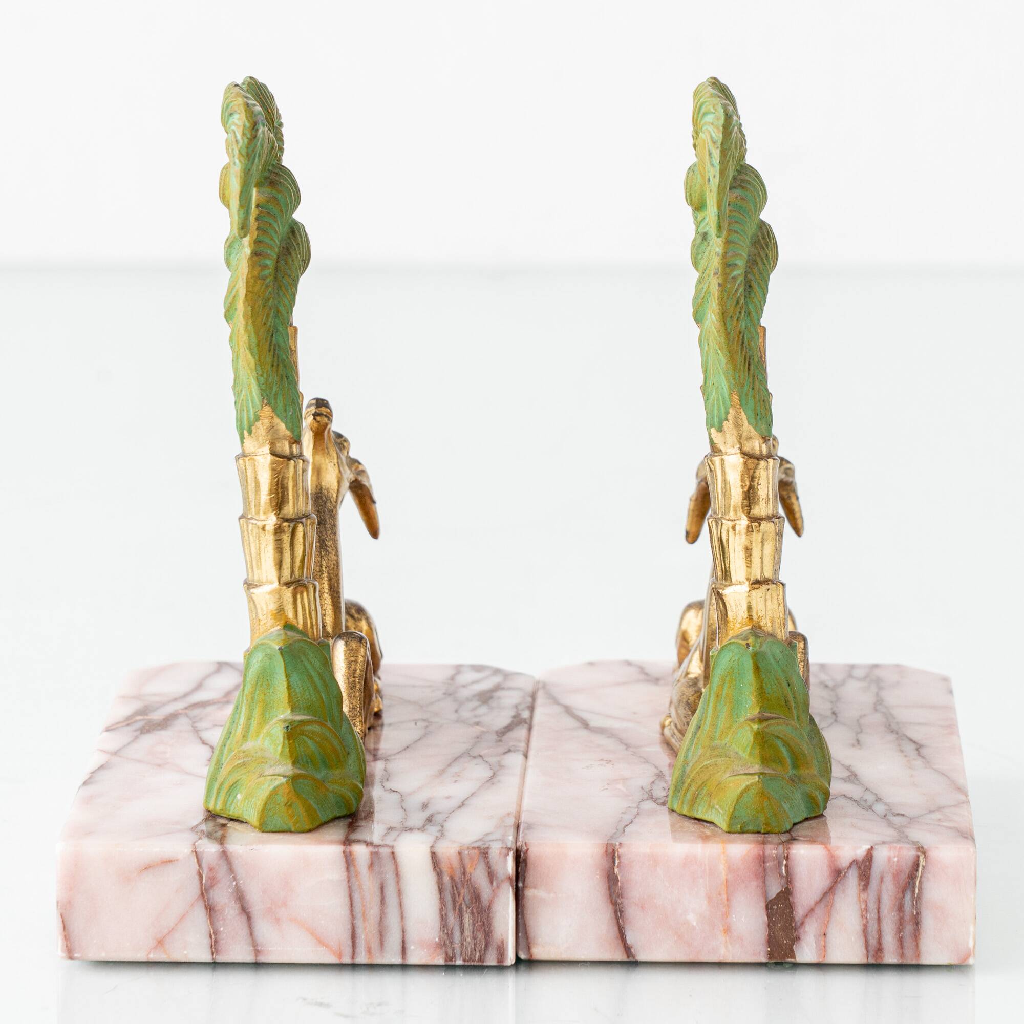 Pair of Art Deco Bookends in Pink Breccia Marble with Antelope and Palm Tree