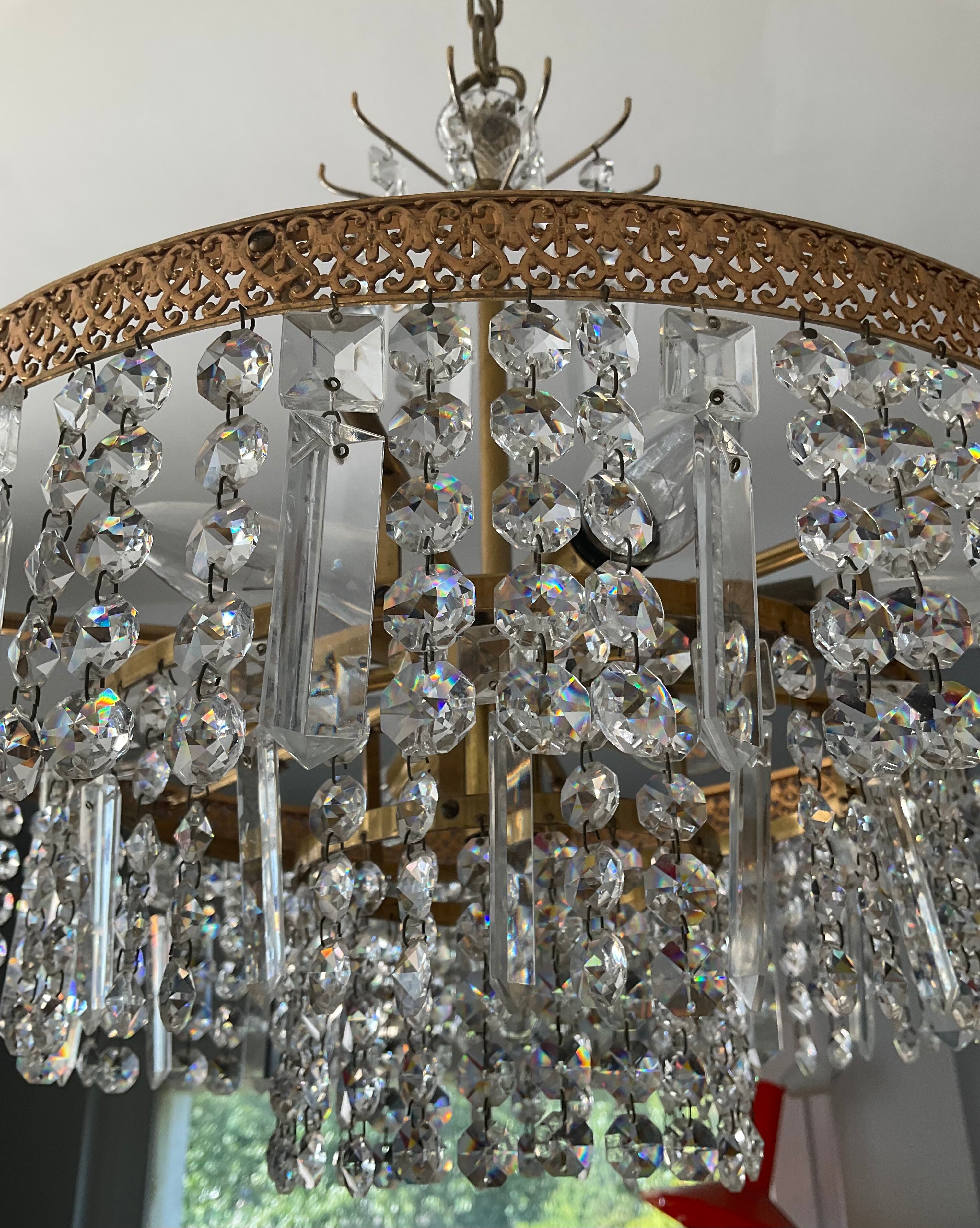 Old brass chandelier and crystal grapevines