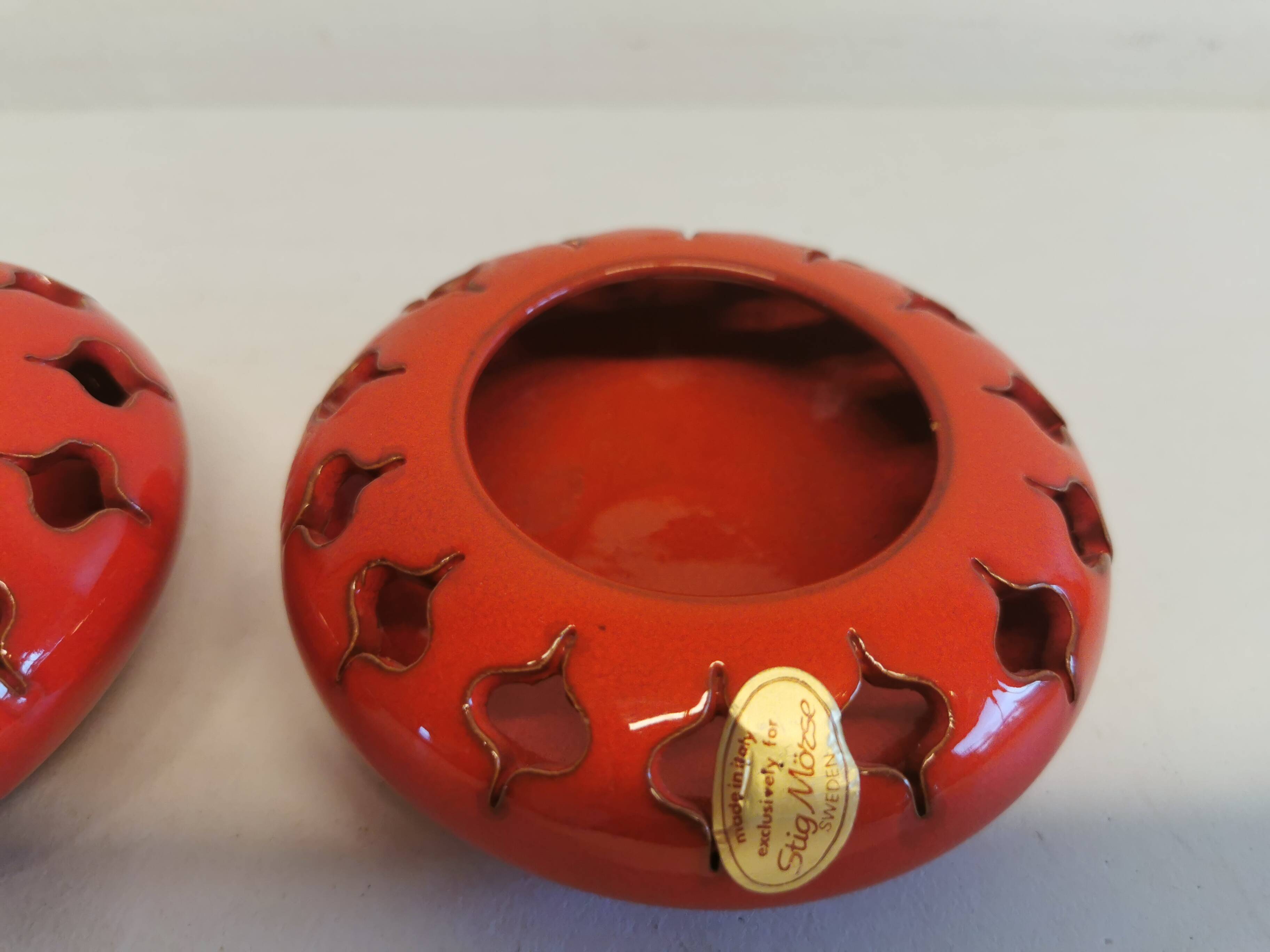 Pair of candle holders from the 1960s-1970s, crafted in red ceramic