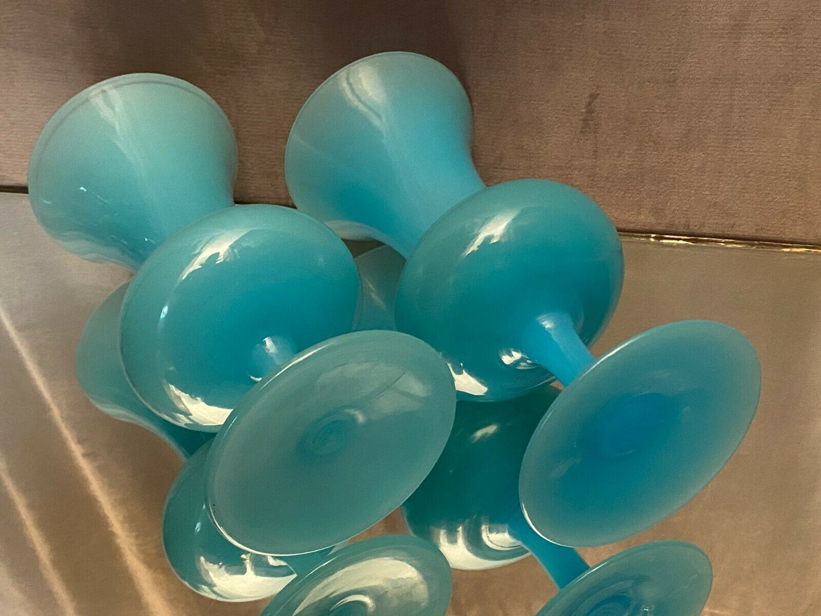 Two vases on a pedestal in blue opaline