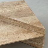 Pair of triangular travertine tables