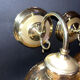 Pair of vintage wall sconces in brass with amber glass globes.