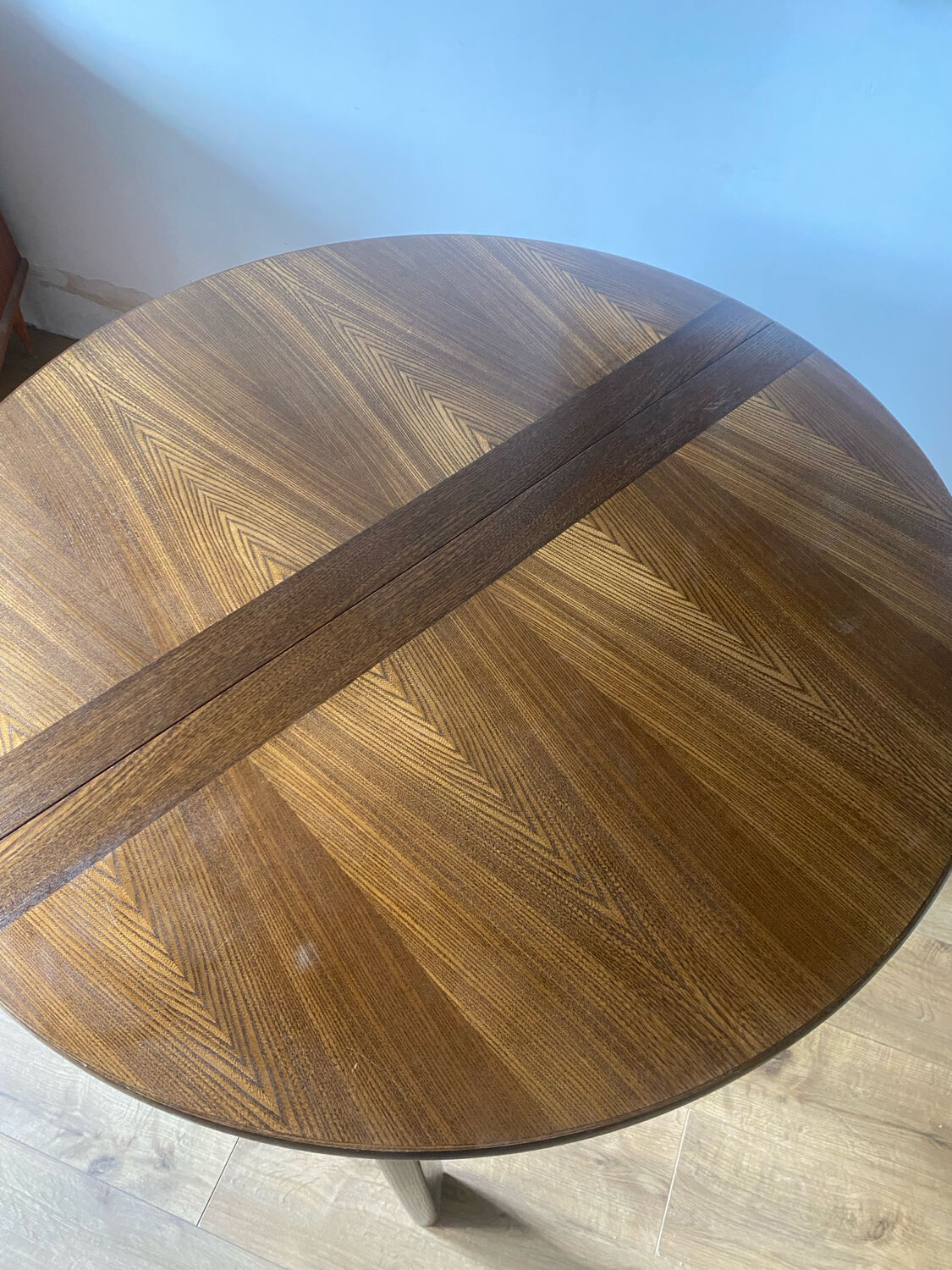 Table with an oak veneer and butterfly extension.
