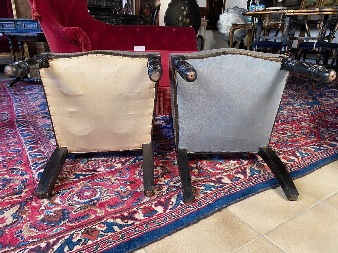 Fake pair of low Napoleon III chairs in blackened wood.