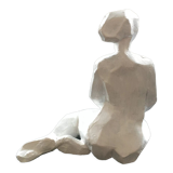 Statuette woman seated in plaster