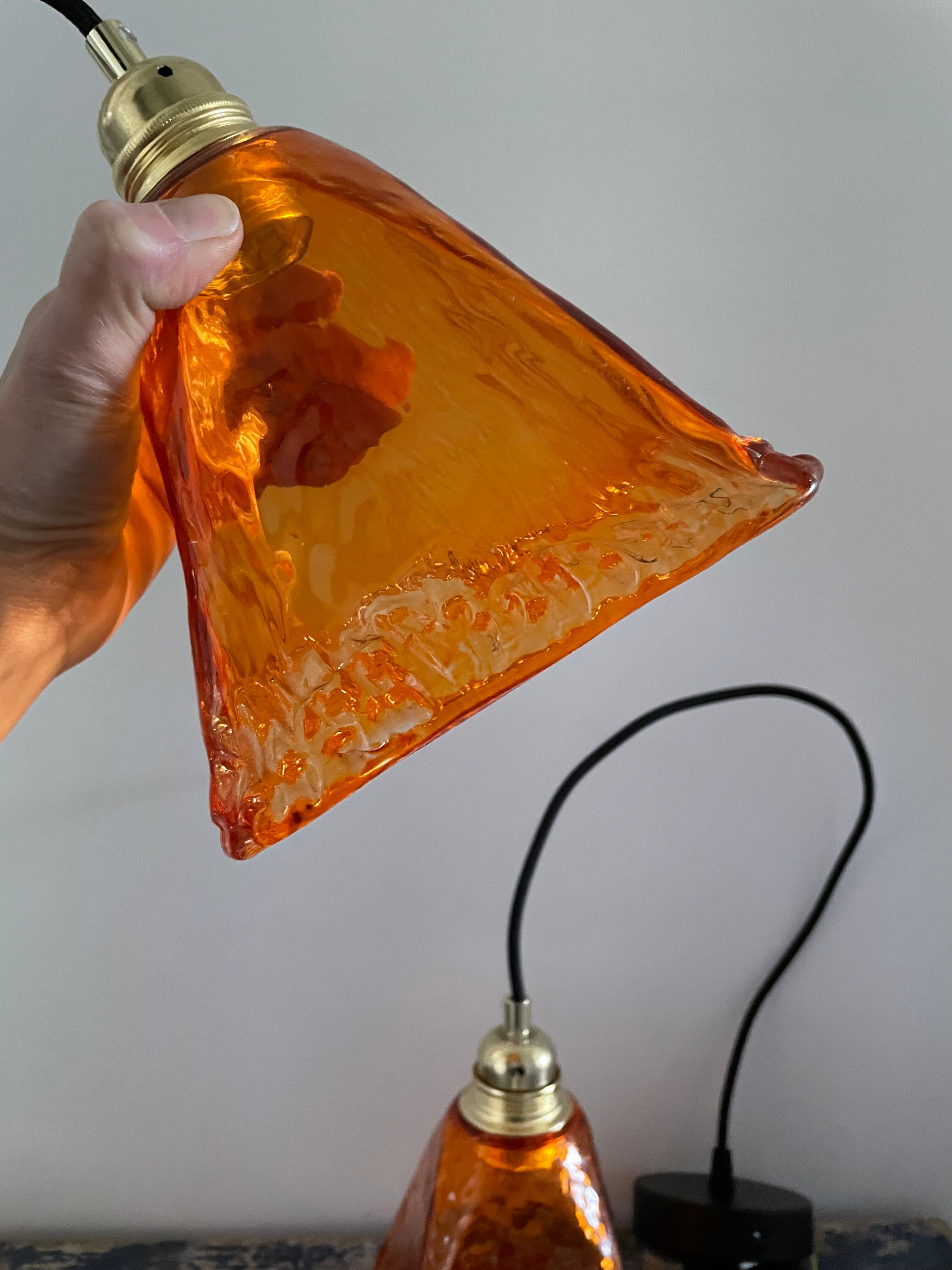 Set of two amber glass hanging lamps