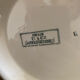 Plate on a presentation stand stamped U&C Sarreguemines Neige.