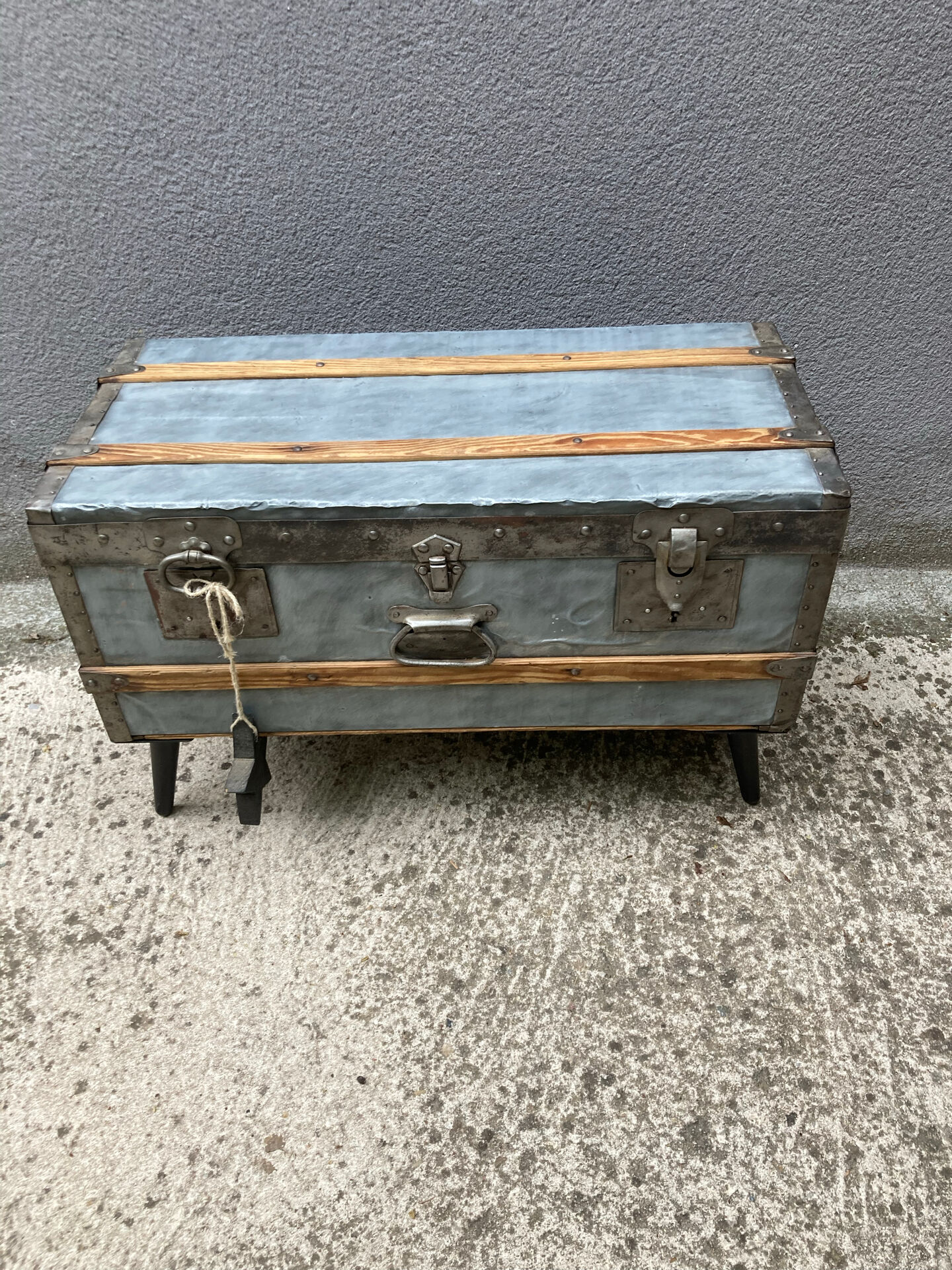 Old zinc trunk with legs, industrial console