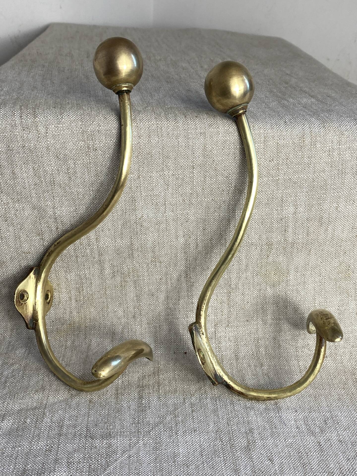 Pair of ball and hook coat hooks in brass