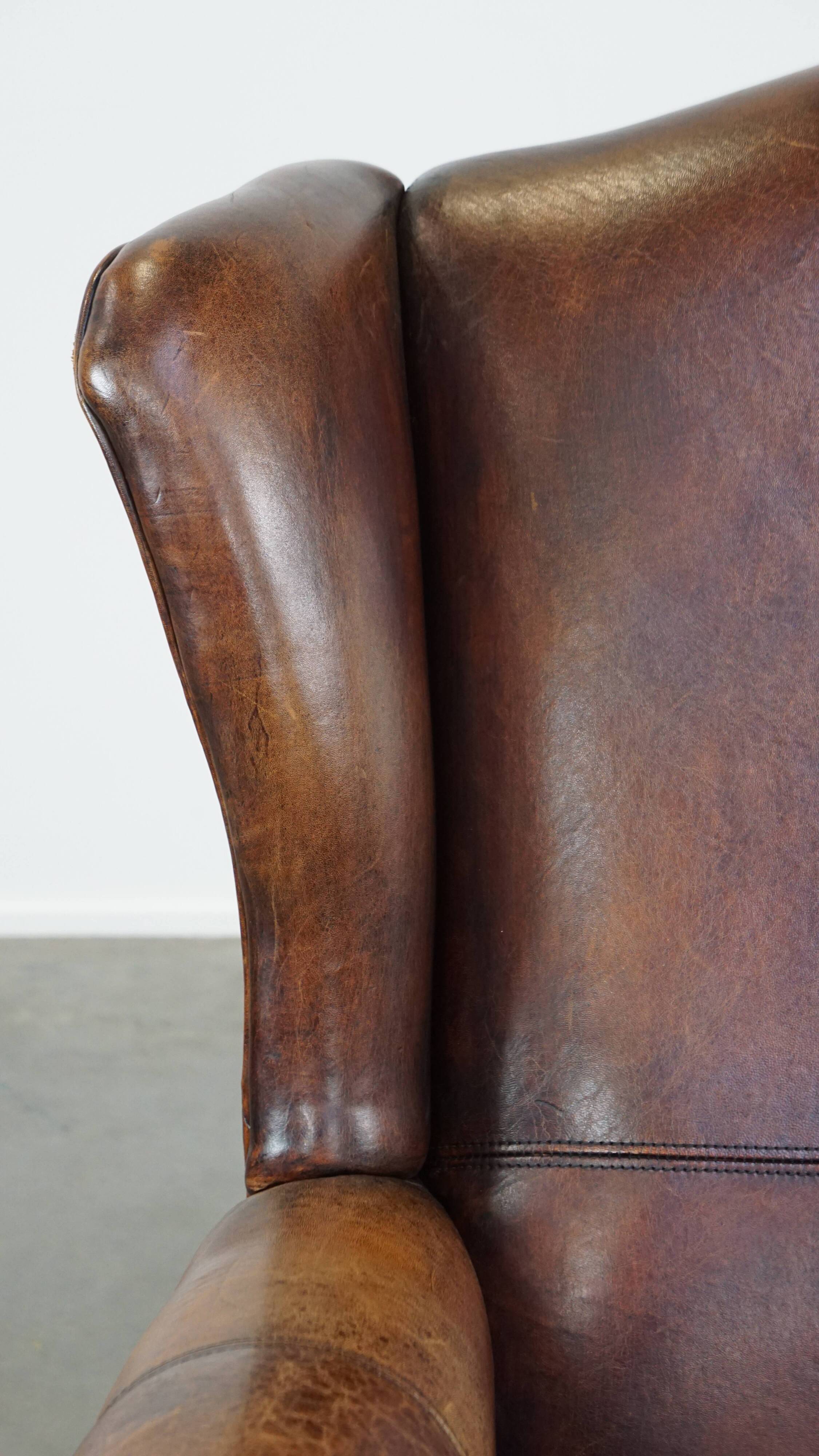 Fauteuil à oreilles en cuir de mouton
