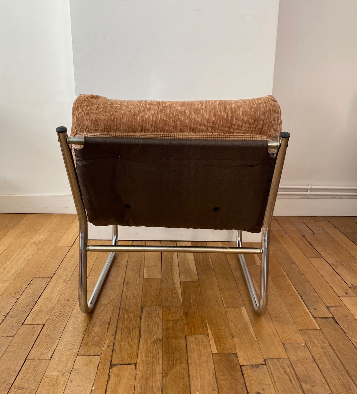 Beige and chrome armchair