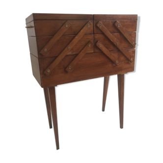 Worker/seamstress in dark wood