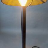 Post-Modern lamp in black metal and gilded brass.