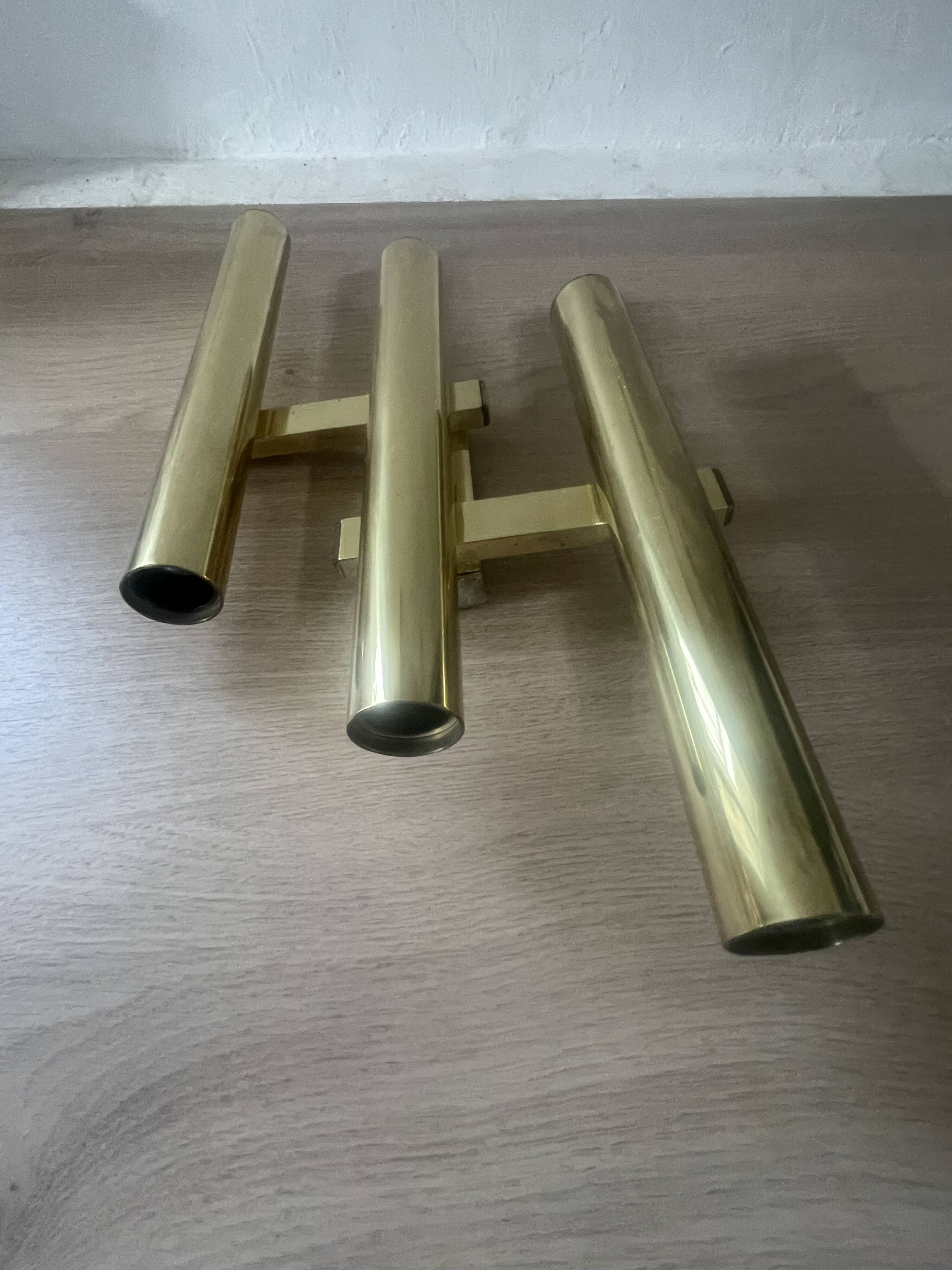 Tubular wall sconces in brass, Italian design from the 1970s, attributed.