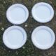 Set of 4 white and blue dinner plates.