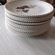 Lot de seize assiettes plates