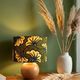 Solid wood ball lamp, lampshade with stylised wax flowers in khaki/yellow.