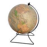 Old illuminated globe world map made of glass and paper.