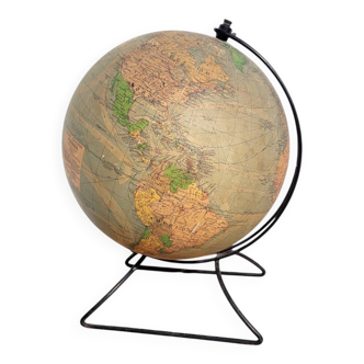 Old illuminated globe world map made of glass and paper.