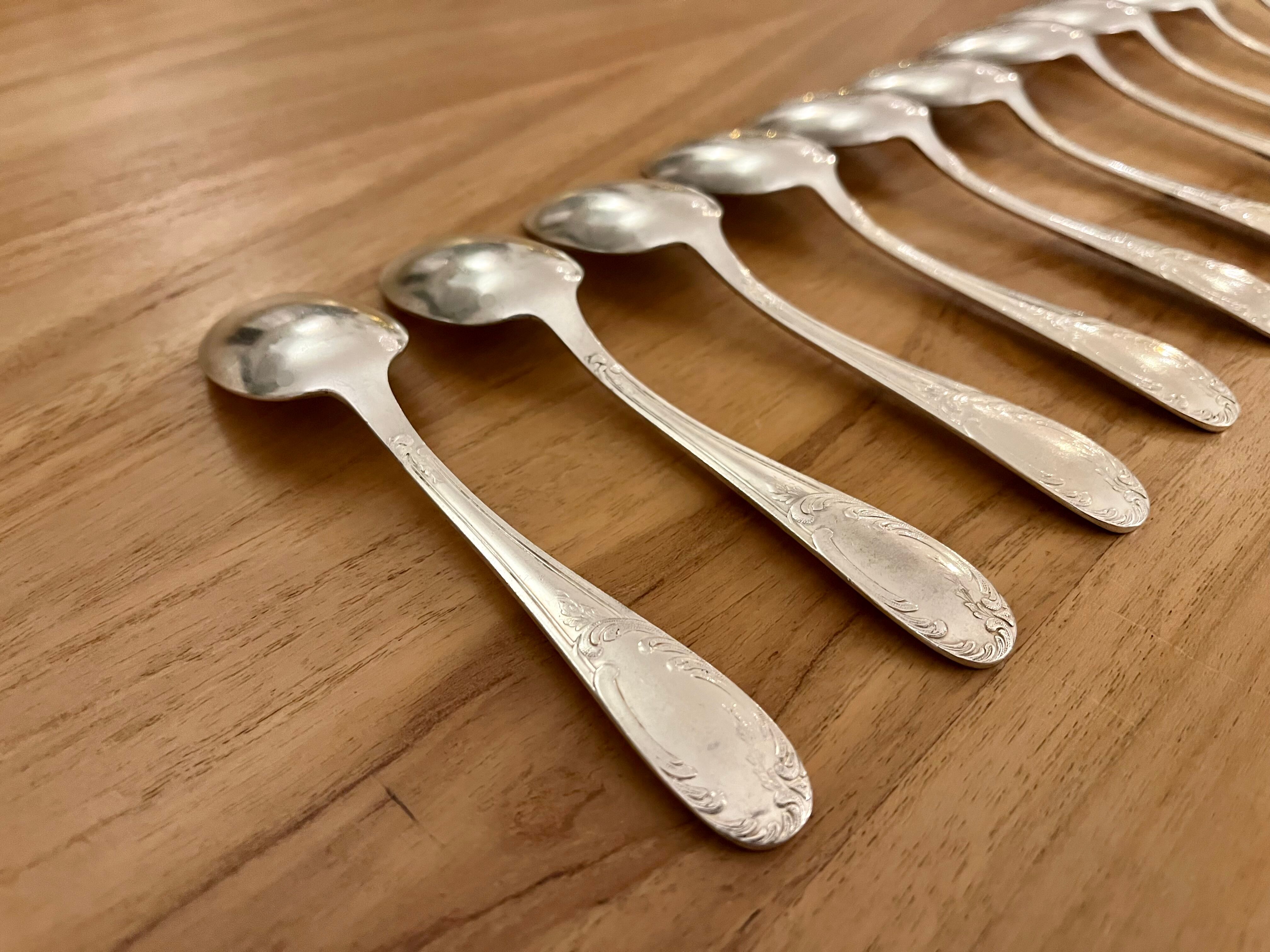 Set of 10 small silver metal spoons