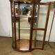 Wooden display case and half-moon mirror