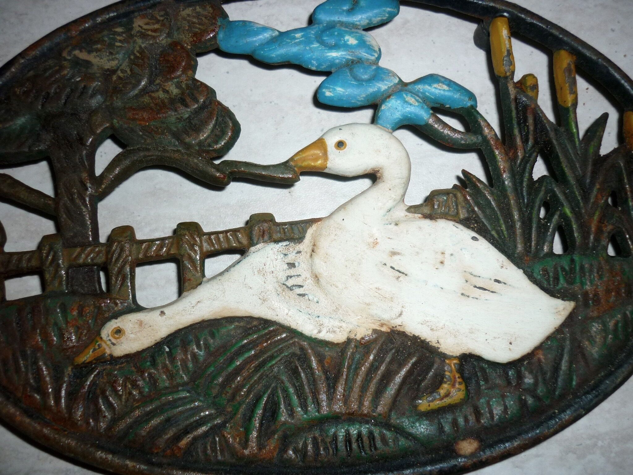 Underside of flat couple of steel geese