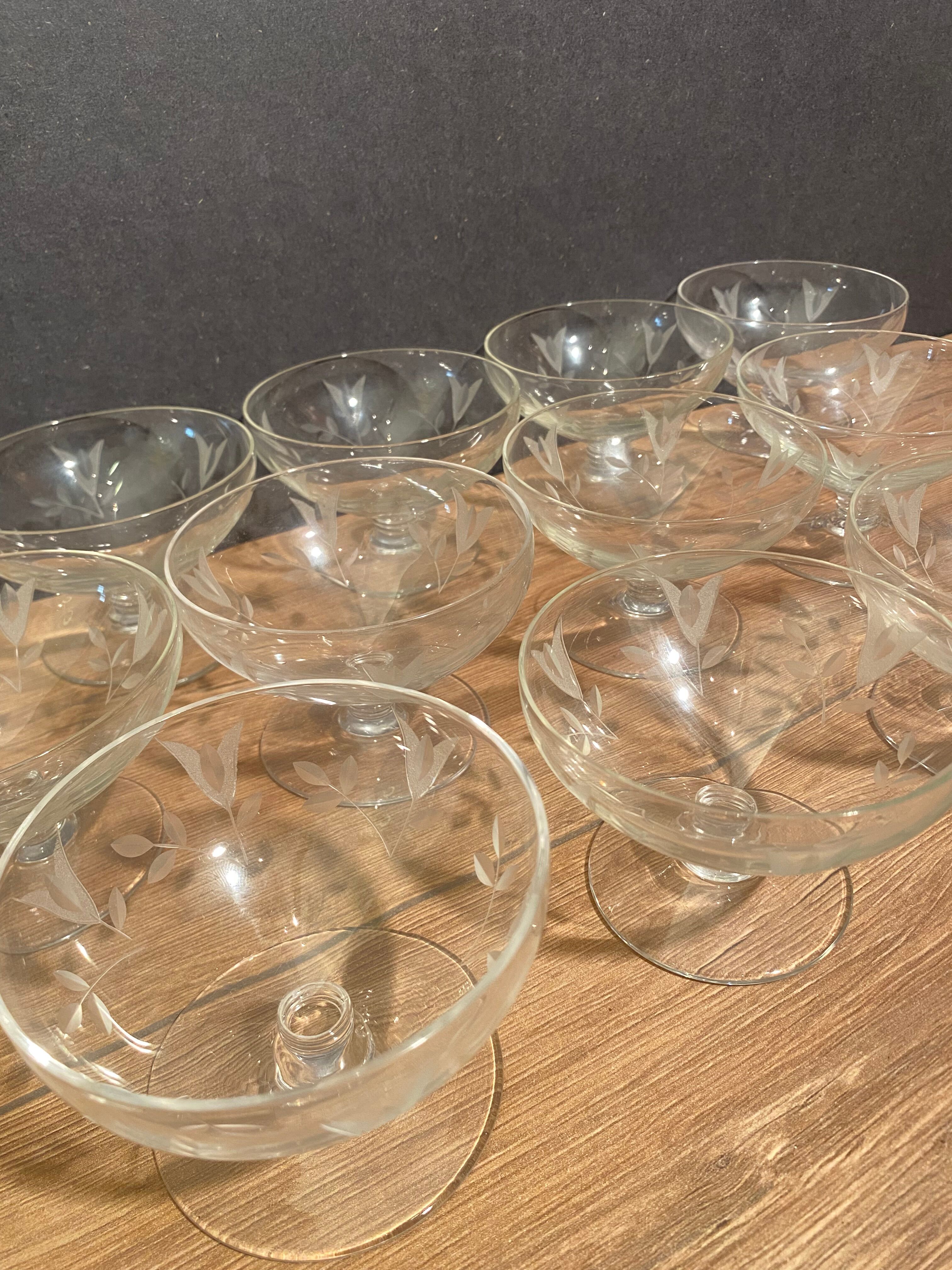 Suite of 12 champagne glasses in cut glass with floral decoration