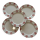 Set of 5 flat plates with ethnic patterns in terracotta.