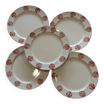 Set of 5 flat plates with ethnic patterns in terracotta.