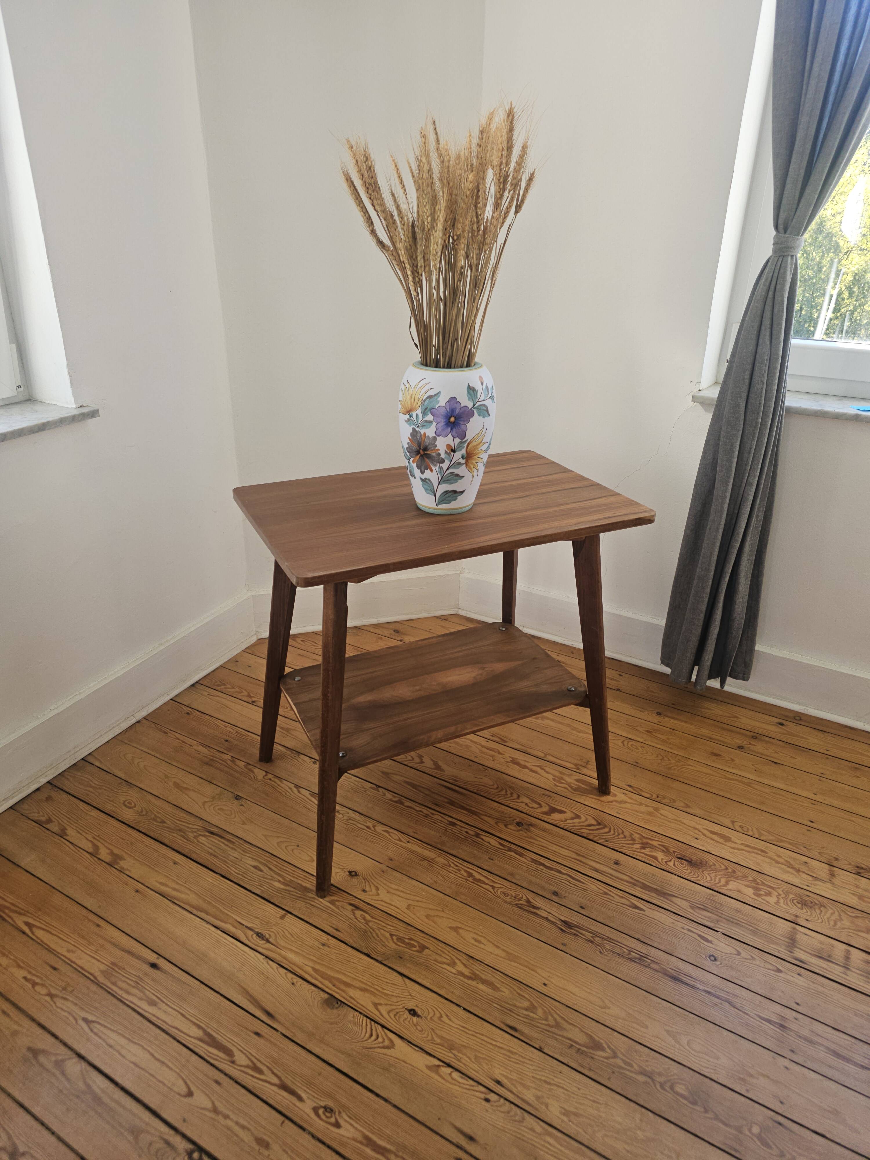 Vintage side table with double top in Scandinavian style.